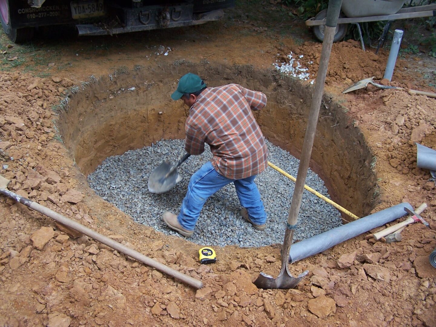 a man working on a drainage