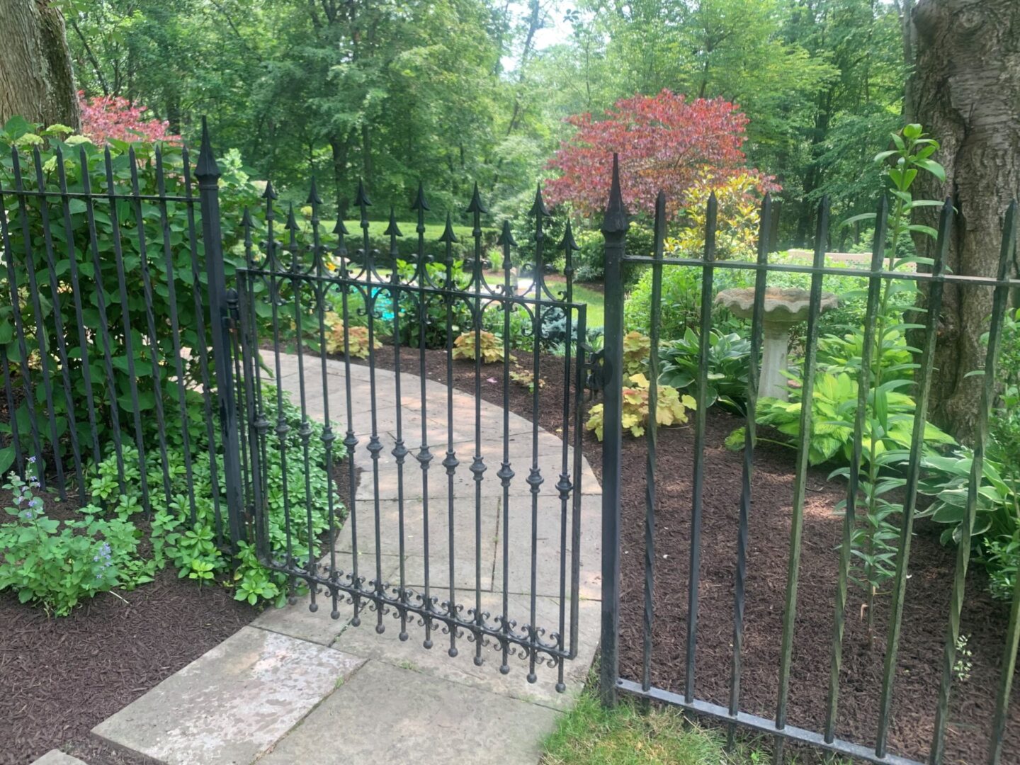 Gate and Railing, Garden with Colorful Plants and Trees