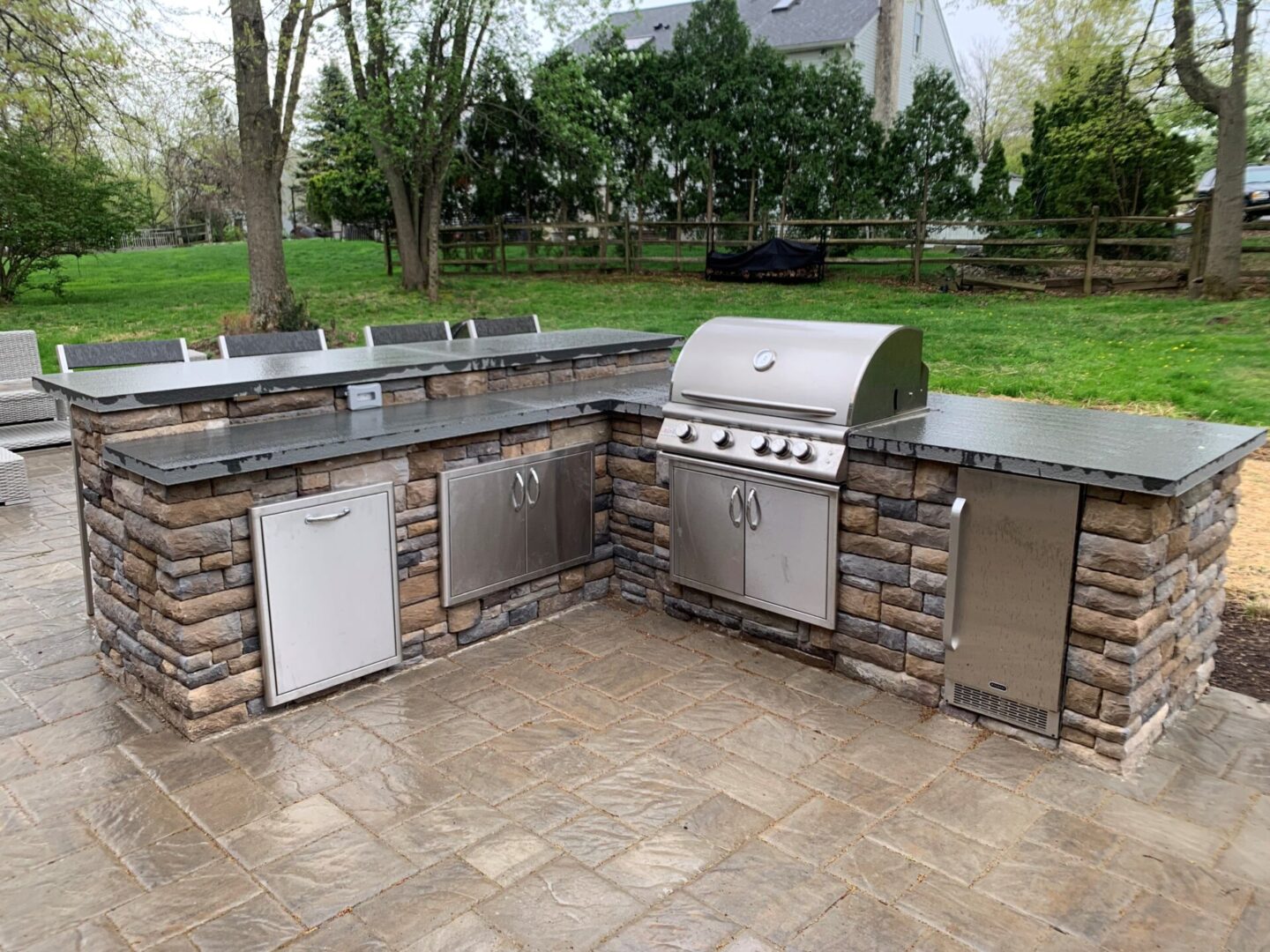 Outdoor Kitchen, Stonework and Serving Area with Chairs
