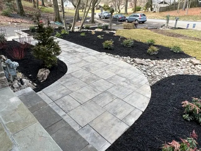 A curved pathway design made of marble and flame stone