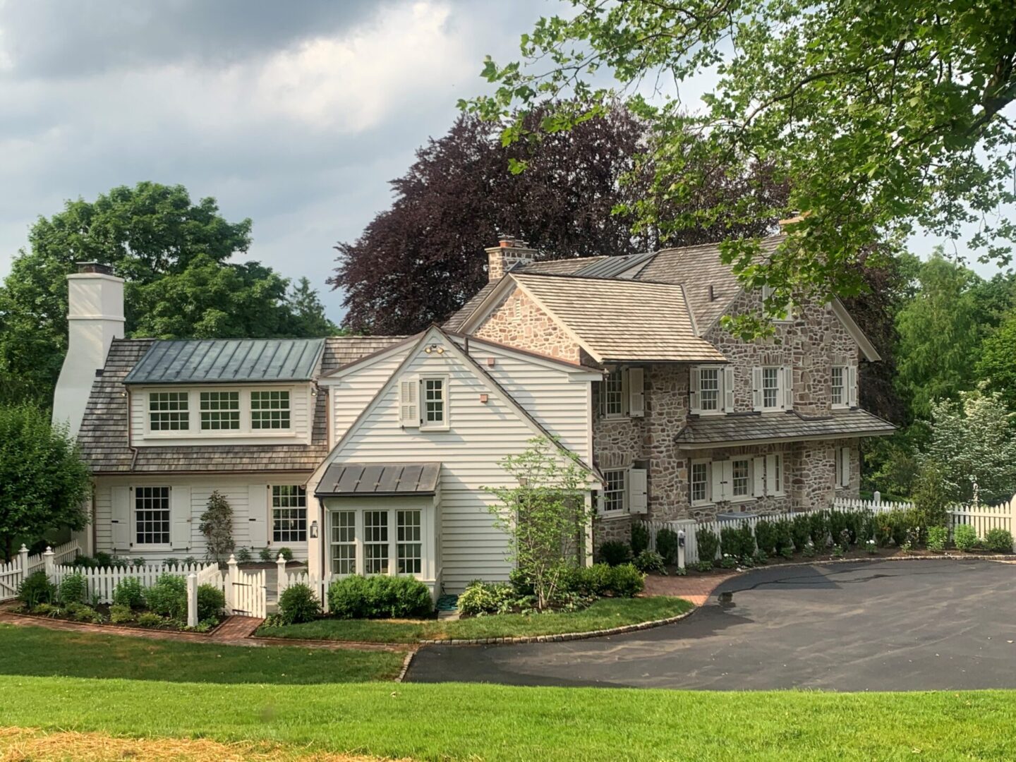 Traditional stone house with lush greenery